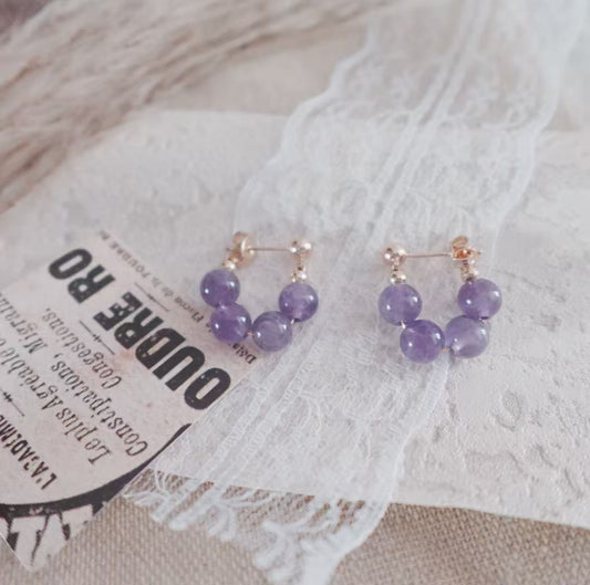 Elegant Amethyst Bead Stud Earrings on a lace background for a stylish accessory look