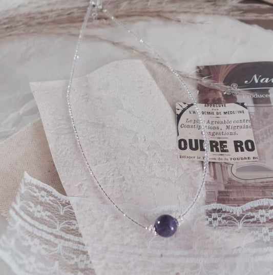 Elegant Amethyst Beaded Necklace featuring a unique purple crystal centerpiece on a delicate silver chain