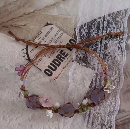 Amethyst Woven Bracelet featuring natural crystals and decorative flower charms