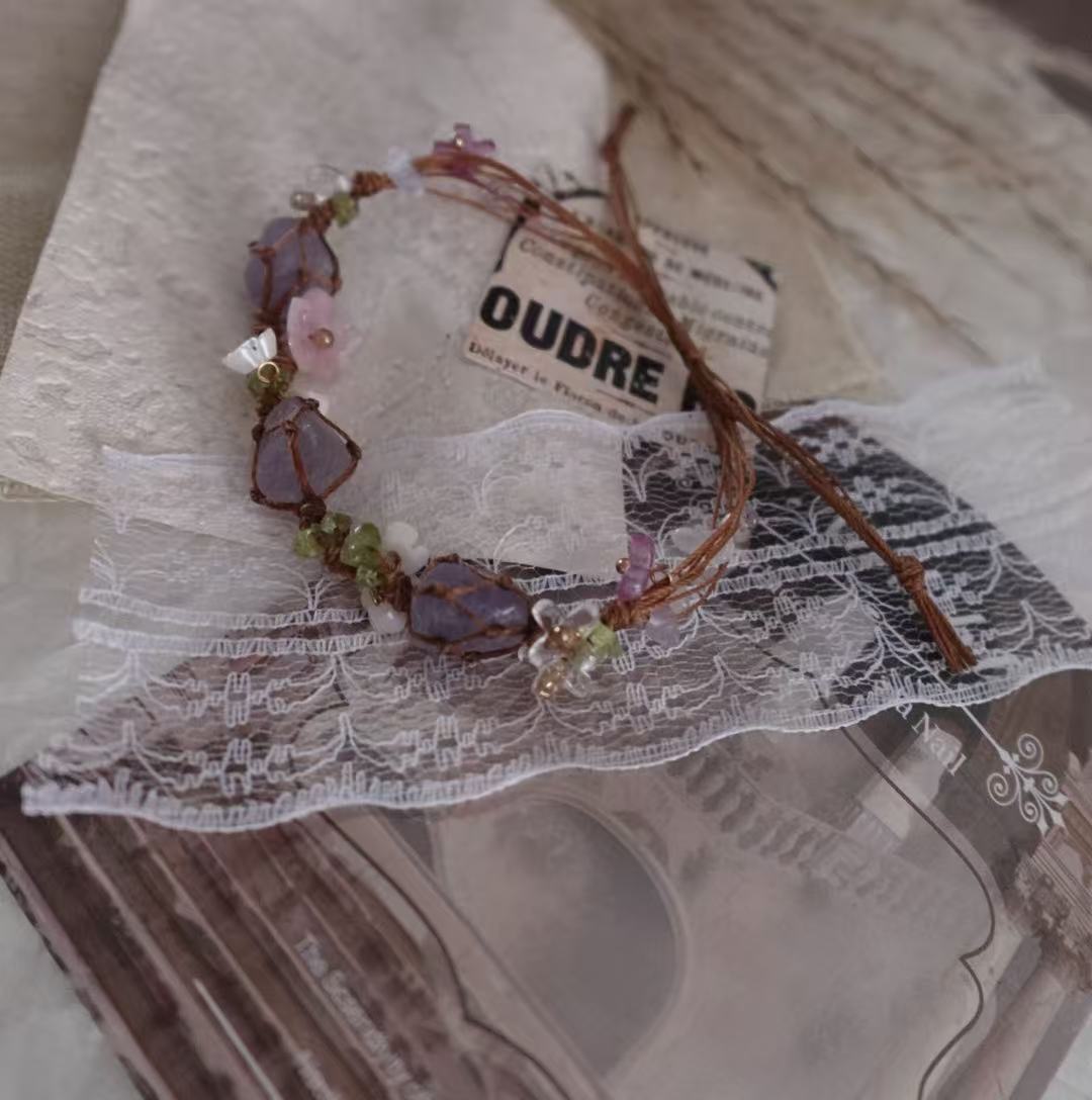 Amethyst Woven Bracelet featuring natural crystals and delicate floral elements for stylish accessories