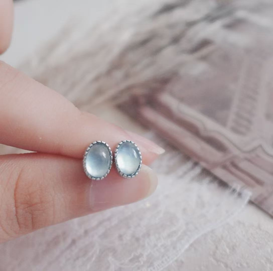 Elegant Aquamarine Oval Stud Earrings set in silver, perfect for everyday wear or special occasions