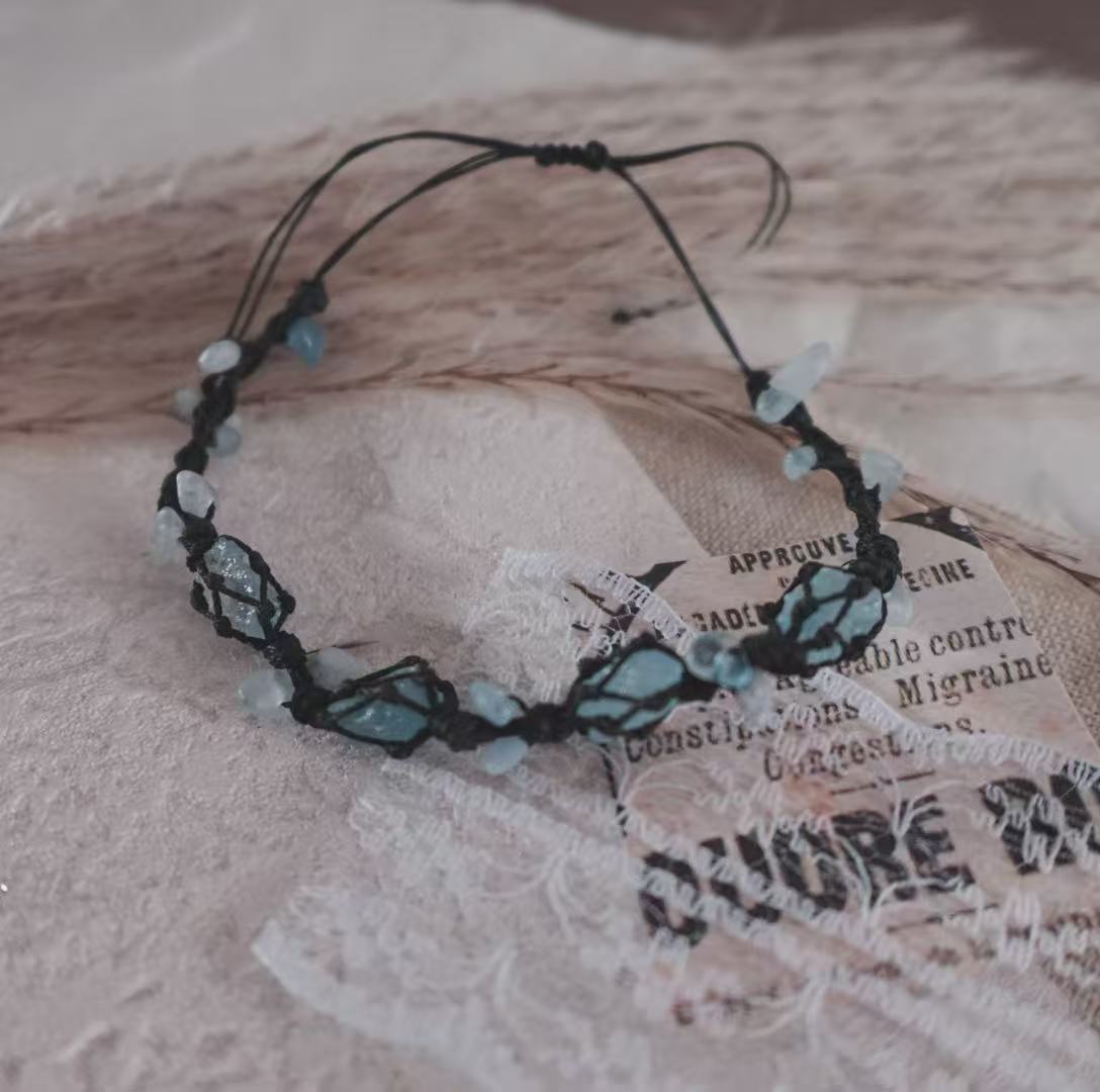 Handcrafted Blue Apatite Woven Bracelet on textured background showcasing its unique crystal design