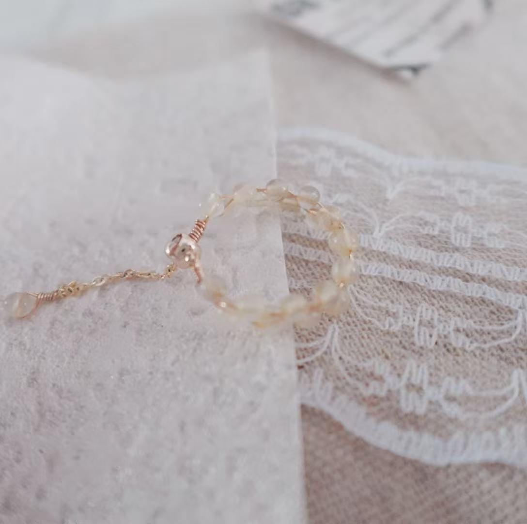 Elegant Citrine Bead Ring on delicate background showcasing its natural crystal design.