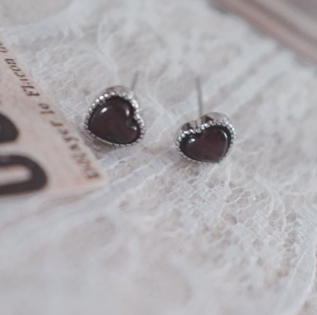 Garnet Heart Stud Earrings with a delicate silver border, ideal for elegant jewelry lovers