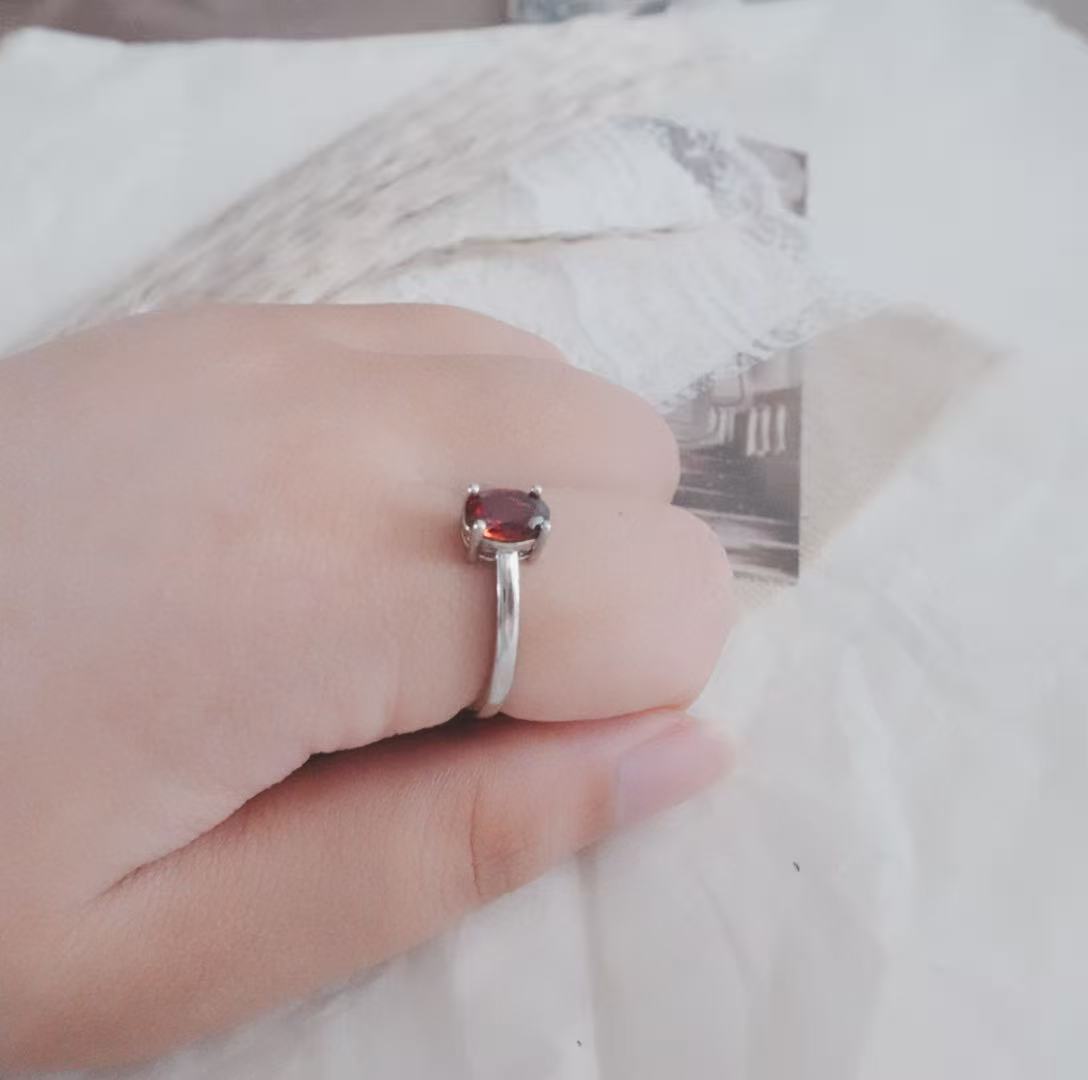 Stylish Oval Garnet Ring set in silver, perfect for elegant jewelry lovers