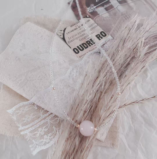 Delicate Rose Quartz Beaded Necklace with white beads and a central pink quartz stone