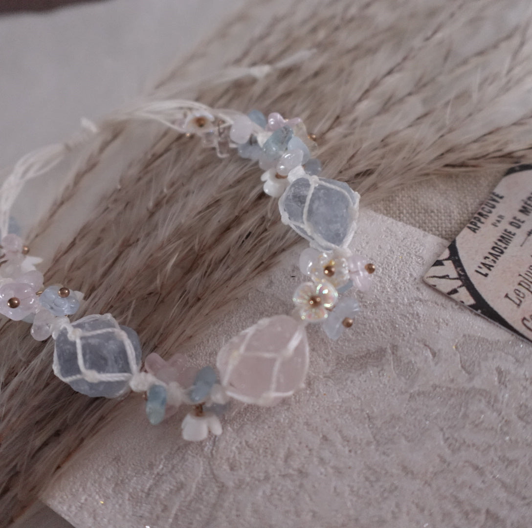 Rose Quartz & Blue Crystal Woven Bracelet with delicate floral accents and shiny beads