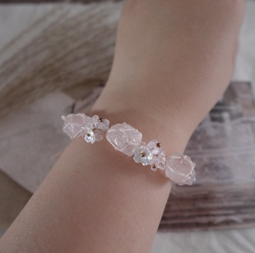 Delicate Rose Quartz Woven Bracelet with floral accents for a natural and elegant look