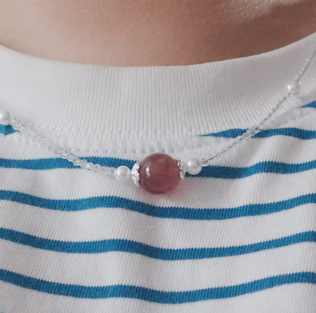 Strawberry Quartz Beaded Necklace featuring a central bead and pearl accents on a delicate chain