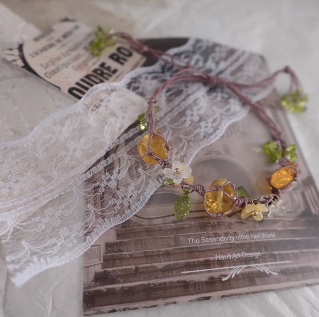 Vintage Yellow Citrine Woven Bracelet adorned with floral accents and vibrant yellow crystals