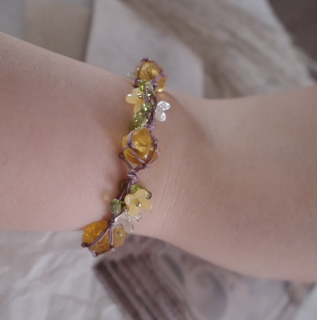 Vintage Yellow Citrine Woven Bracelet with Floral Accents on a Wrist