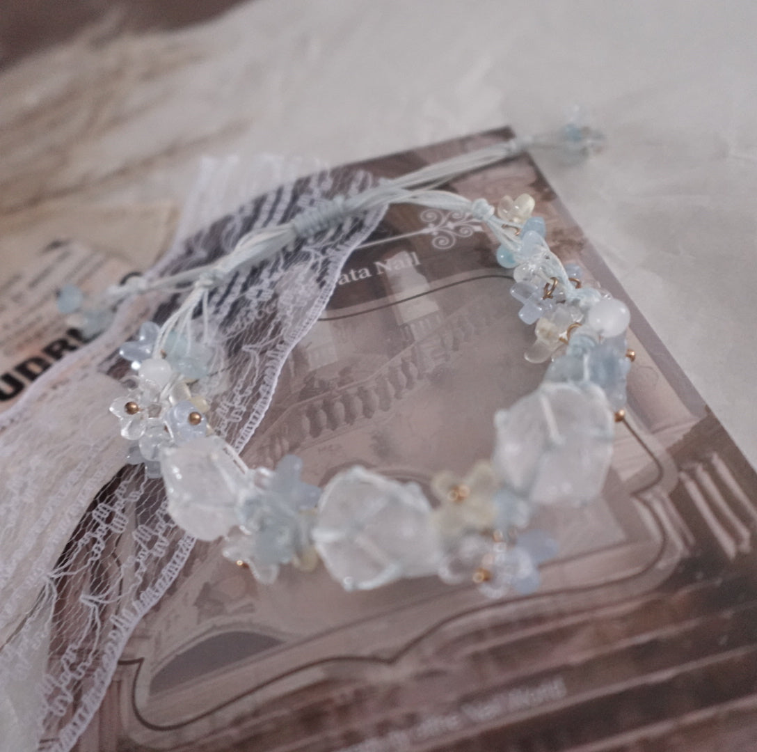 Delicate White Crystal Woven Bracelet featuring transparent beads and floral accents for elegant style