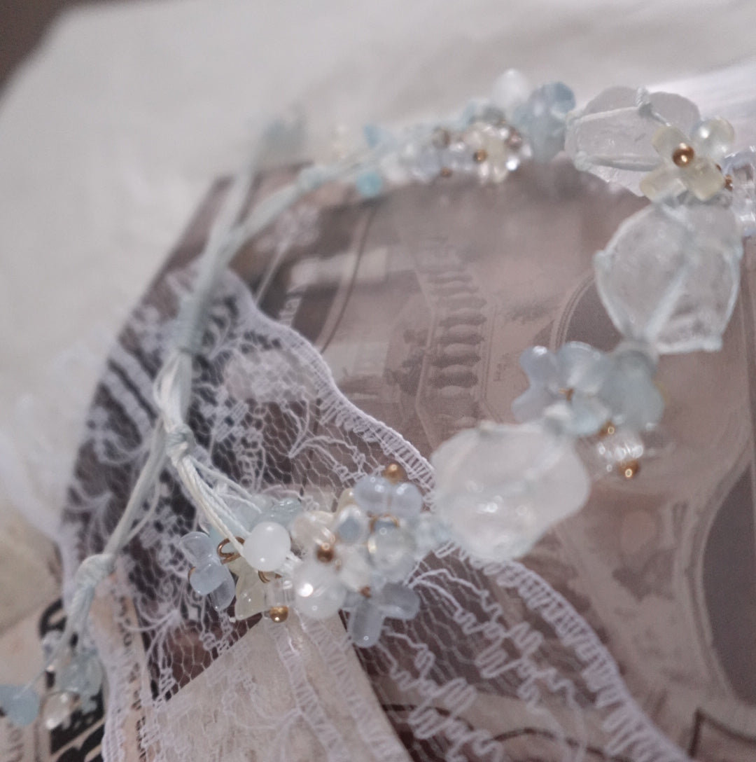 Delicate White Crystal Woven Bracelet with intricate designs and natural gemstones.