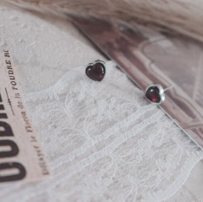 Garnet Heart Stud Earrings beautifully designed with a polished finish, perfect for elegant occasions