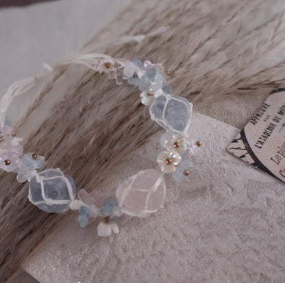 Rose Quartz & Blue Crystal Woven Bracelet with delicate floral accents and shiny beads