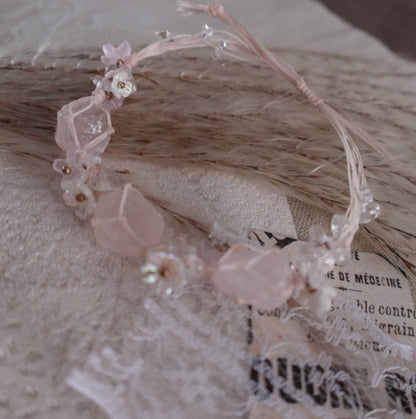 Handcrafted Rose Quartz Woven Bracelet with delicate floral accents and crystal beads