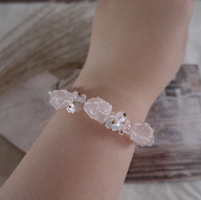 Delicate Rose Quartz Woven Bracelet with floral accents for a natural and elegant look